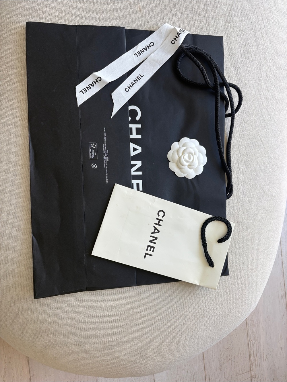 CHANEL black and white gift bags with ribbon and camellia